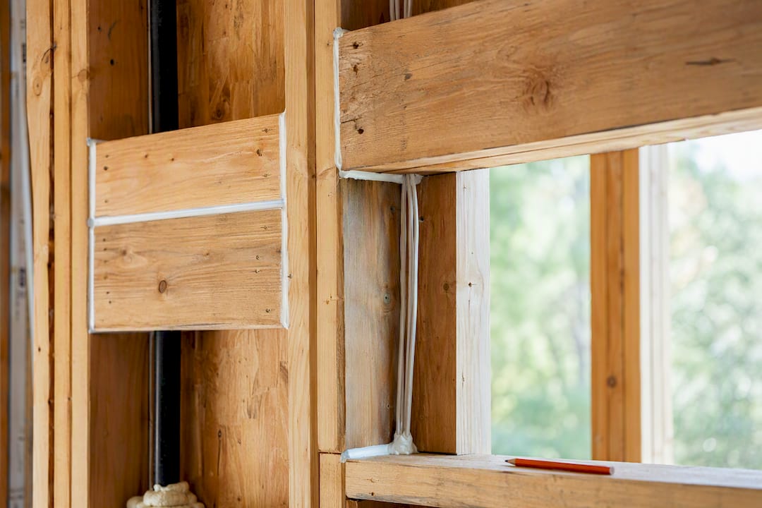 Fire-blocking and header inside framed wall